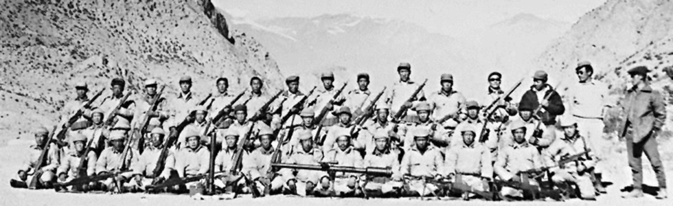 Tibetan Resistance fighters pose with weapons following CIA arms drop