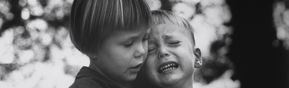 Big sister shows compassion to her little brother