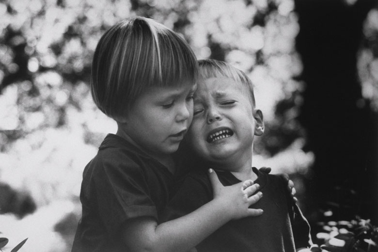 Big sister shows compassion to her little brother